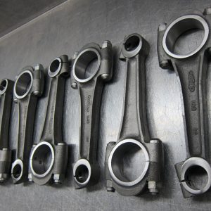 Leroi connecting rods on a workbench