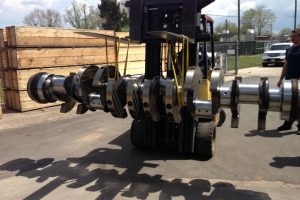 Caterpillar crankshaft suspended by forklift with sling