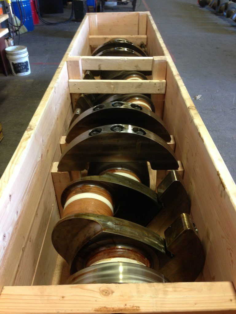 Crated Caterpillar crankshaft in warehouse