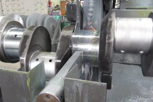 Closeup of crankshaft grinding of hard chrome plating