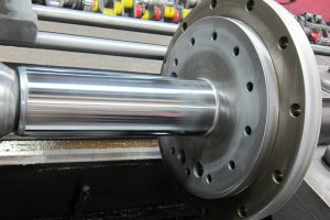 Flanged shaft restored by hard chrome plating, grinding and polishing