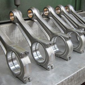 Waukesha connecting rods on a workbench