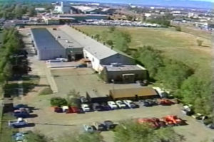 Power Engineering Company, aerial view with Rocky Mountains in background, 1985