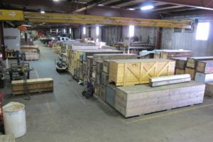 Power Engineering Company warehouse showing crates with crankshafts inside