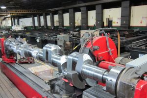 Ajax Crankshaft in Crankshaft Grinder, hard chrome plating tanks in the background