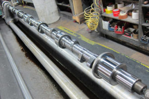 Reconditioned Waukesha Camshaft in polishing machine